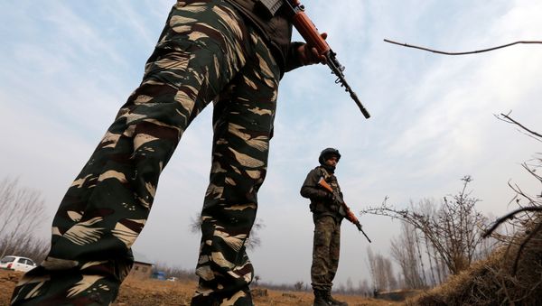 (File) Policemen stand guard outside the Central Reserve Police Force (CRPF) training centre during a gunbattle with suspected militants in Lethpora in south Kashmir’s Pulwama district, December 31, 2017 - Sputnik International