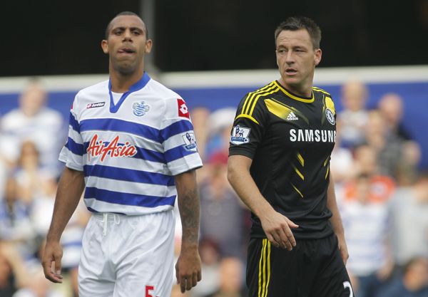 Queens Park Rangers' Anton Ferdinand, left, is marked by Chelsea's John Terry as Chelsea defend a corner during their English Premier League soccer match at Loftus Road stadium, London, Saturday, Sept. 15, 2012. - Sputnik International