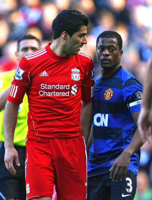 In this Oct. 15, 2011 file photo, Manchester United's Patrice Evra argues with Liverpool's Luis Suarez, left, during their English Premier League soccer match at Anfield, Liverpool, England - Sputnik International