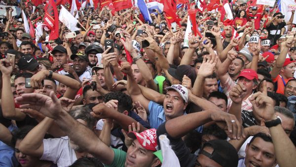 Opposition supporters cheer during a rally where Salvador Nasralla reaffirmed his claim on the presidency of Honduras, in the central park of San Pedro Sula, Honduras, Saturday, Jan. 6, 2018 - Sputnik International