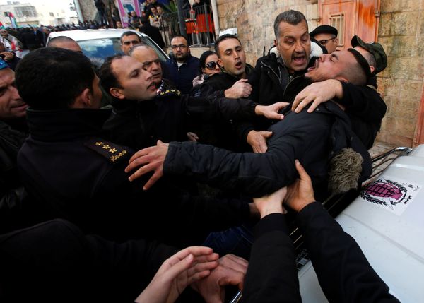 A demonstrator reacts during a protest against the visit of Greek Orthodox Patriarch of Jerusalem Theophilos III, in the West Bank city of Bethlehem January 6, 2018 - Sputnik International