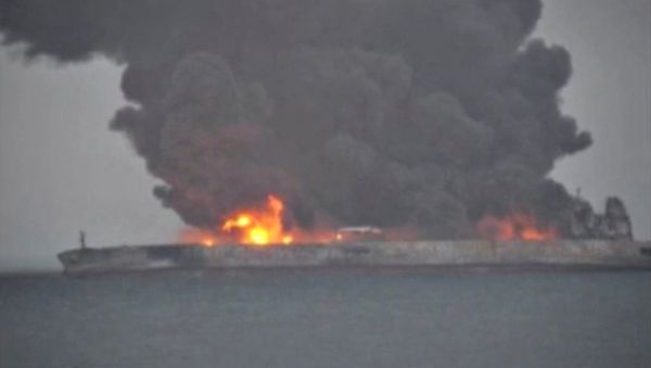 Smoke and fire is seen from Panama-registered tanker SANCHI carrying Iranian oil after it collided with a Chinese freight ship in the East China Sea, in this still image taken from a January 7, 2018 video - Sputnik International