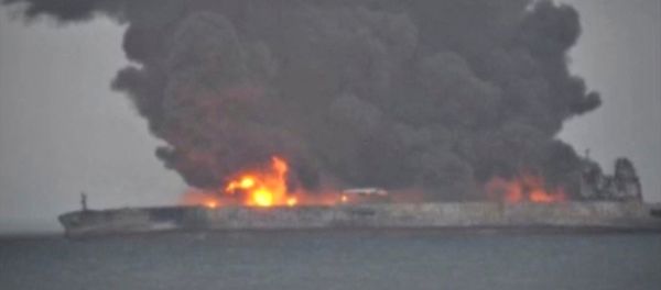 Smoke and fire is seen from Panama-registered tanker SANCHI carrying Iranian oil after it collided with a Chinese freight ship in the East China Sea, in this still image taken from a January 7, 2018 video - Sputnik International