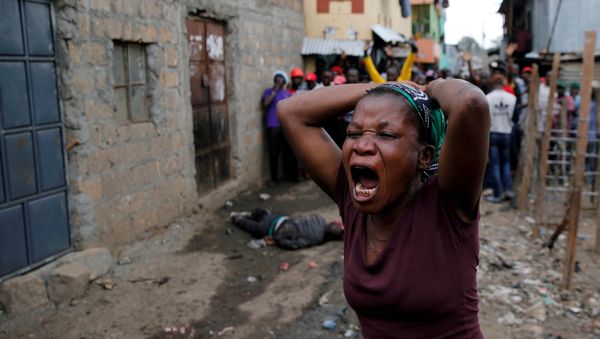 A woman gestures as she mourns the death of a protester in Mathare, in Nairobi, Kenya, August 9, 2017 A woman gestures as she mourns the death of a protester in Mathare, in Nairobi, Kenya, August 9, 2017 - Sputnik International