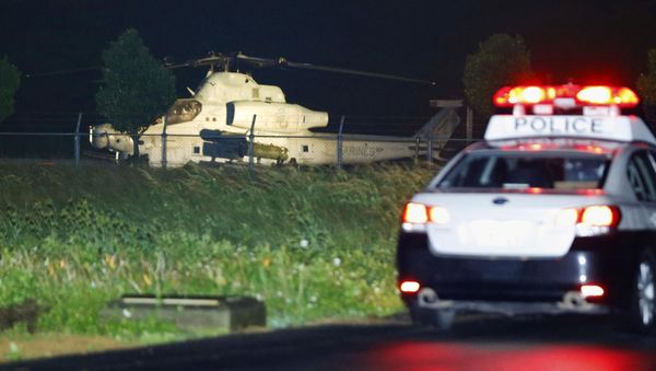 A U.S. attack helicopter that made an emergency landing is seen in Yomitan on Okinawa island, Japan in this photo taken by Kyodo on January 8, 2018 A U.S. attack helicopter that made an emergency landing is seen in Yomitan on Okinawa island, Japan in this photo taken by Kyodo on January 8, 2018 - Sputnik International