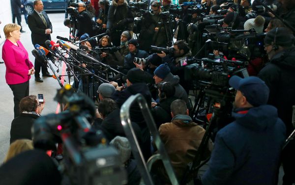 Leader of the Christian Democratic Union (CDU) and the acting German Chancellor Angela Merkel delivers a statement before exploratory talks about forming a new coalition government at the SPD headquarters in Berlin, Germany, January 7, 2018. Leader of the Christian Democratic Union (CDU) and the acting German Chancellor Angela Merkel delivers a statement before exploratory talks about forming a new coalition government at the SPD headquarters in Berlin, Germany, January 7, 2018. - Sputnik International