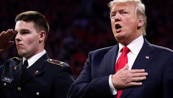 U.S. President Donald Trump sings along with the national anthem before the NCAA College Football Playoff Championship game between Alabama and Georgia in Atlanta, Georgia, U.S. January 8, 2018 - Sputnik International