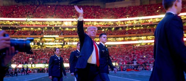 President Donald Trump walks off the field following the national anthem before the start of the NCAA National Championship game at Mercedes-Benz Stadium, Monday, Jan. 8, 2018, in Atlanta, between Alabama and Georgia. - Sputnik International