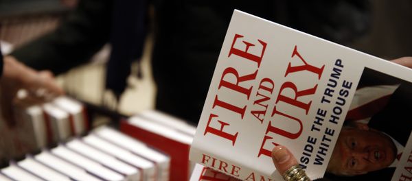A customer looks at a copy of Michael Wolff's Fire and Fury: Inside the Trump White House as they go on sale at a bookshop, in London, Tuesday, Jan. 9, 2018. A customer looks at a copy of Michael Wolff's Fire and Fury: Inside the Trump White House as they go on sale at a bookshop, in London, Tuesday, Jan. 9, 2018. - Sputnik International