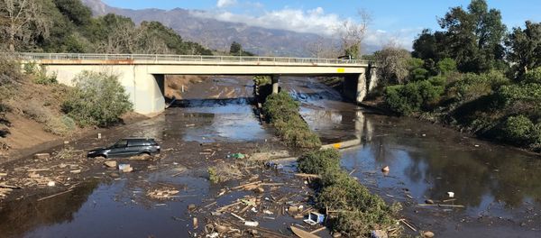 An abandoned car is seen stuck in flooded water on the 101 freeway after a mudslide in Montecito, California, U.S. January 10, 2018 An abandoned car is seen stuck in flooded water on the 101 freeway after a mudslide in Montecito, California, U.S. January 10, 2018 - Sputnik International