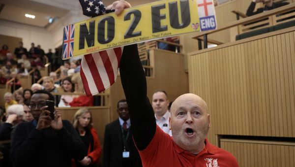 A demonstrator holds a pro-Brexit sign and a U.S. flag, as the speech by the Mayor of London, Sadiq Khan, is interrupted at the Fabian Society New Year Conference, in central London, Britain January 13, 2018 A demonstrator holds a pro-Brexit sign and a U.S. flag, as the speech by the Mayor of London, Sadiq Khan, is interrupted at the Fabian Society New Year Conference, in central London, Britain January 13, 2018 - Sputnik International