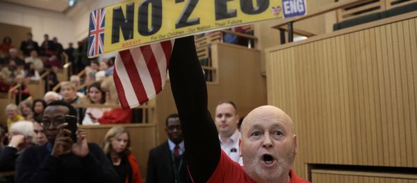 A demonstrator holds a pro-Brexit sign and a U.S. flag, as the speech by the Mayor of London, Sadiq Khan, is interrupted at the Fabian Society New Year Conference, in central London, Britain January 13, 2018 A demonstrator holds a pro-Brexit sign and a U.S. flag, as the speech by the Mayor of London, Sadiq Khan, is interrupted at the Fabian Society New Year Conference, in central London, Britain January 13, 2018 - Sputnik International