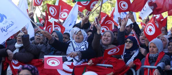 People wave national flags during demonstrations on the seventh anniversary of the toppling of president Zine El-Abidine Ben Ali, in Tunis, Tunisia January 14, 2018 People wave national flags during demonstrations on the seventh anniversary of the toppling of president Zine El-Abidine Ben Ali, in Tunis, Tunisia January 14, 2018 - Sputnik International