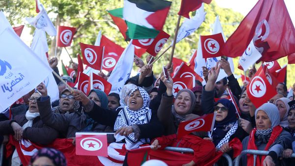 People wave national flags during demonstrations on the seventh anniversary of the toppling of president Zine El-Abidine Ben Ali, in Tunis, Tunisia January 14, 2018 People wave national flags during demonstrations on the seventh anniversary of the toppling of president Zine El-Abidine Ben Ali, in Tunis, Tunisia January 14, 2018 - Sputnik International