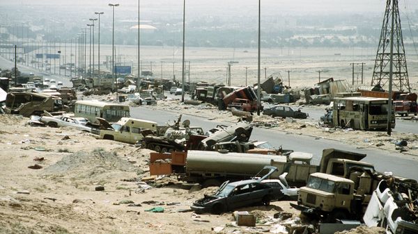 Demolished vehicles line Highway 80, also known as the Highway of Death, the route fleeing Iraqi forces took as they retreated fom Kuwait during Operation Desert Storm - Sputnik International
