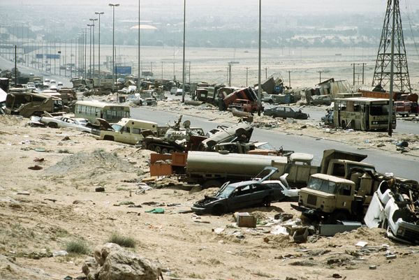 Demolished vehicles line Highway 80, also known as the Highway of Death, the route fleeing Iraqi forces took as they retreated fom Kuwait during Operation Desert Storm - Sputnik International