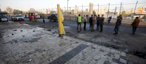 Iraqi security forces inspect the site of a bomb attack in Baghdad, Iraq January 15, 2018 Iraqi security forces inspect the site of a bomb attack in Baghdad, Iraq January 15, 2018 - Sputnik International