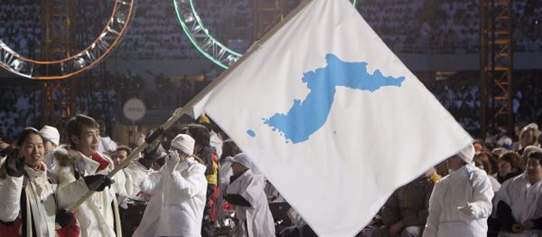 In this Feb. 10, 2006, file photo, Korea flag-bearer's Bora Lee and Jong-In Lee, carrying a unification flag lead their teams into the stadium during the 2006 Winter Olympics opening ceremony in Turin, Italy - Sputnik International