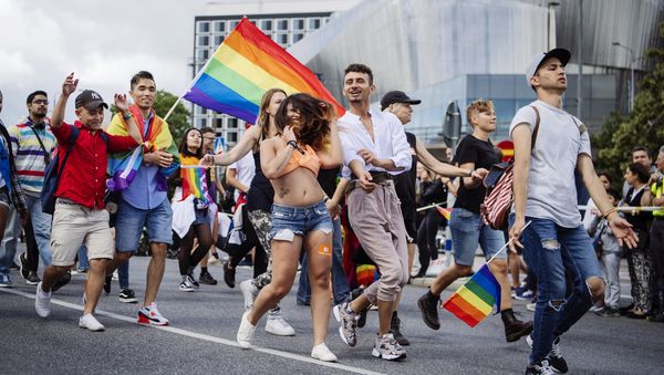 People march during at the annual Gay Pride parade in central Stockholm on August 5, 2017 People march during at the annual Gay Pride parade in central Stockholm on August 5, 2017 - Sputnik International