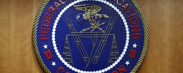 The seal of the Federal Communications Commission (FCC) is seen before an FCC meeting to vote on net neutrality in Washington. (File) The seal of the Federal Communications Commission (FCC) is seen before an FCC meeting to vote on net neutrality in Washington. (File) - Sputnik International