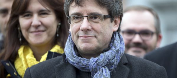 Ousted Catalan leader Carles Puigdemont, center, stands with elected Catalan lawmakers of his Together for Catalonia party at a park in Brussels Ousted Catalan leader Carles Puigdemont, center, stands with elected Catalan lawmakers of his Together for Catalonia party at a park in Brussels - Sputnik International