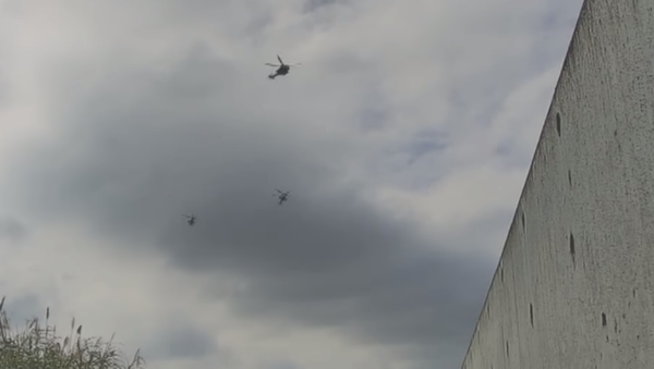 US military helicopters are seen in security footage flying over Futenma No. 2 Elementary School in Okinawa - Sputnik International