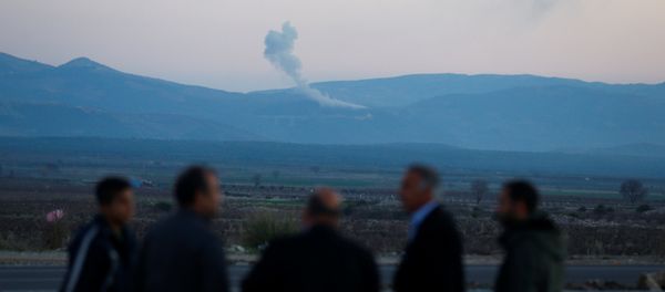Smoke rises from the Syria's Afrin region, as it is pictured from near the Turkish town of Hassa, on the Turkish-Syrian border in Hatay province, Turkey January 20, 2018 - Sputnik International