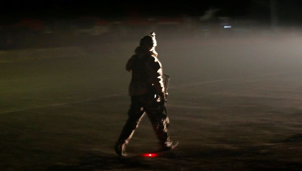 A member of the Afghan security forces arrives the site of an attack on the Intercontinental Hotel in Kabul, Afghanistan January 20, 2018. A member of the Afghan security forces arrives the site of an attack on the Intercontinental Hotel in Kabul, Afghanistan January 20, 2018. - Sputnik International