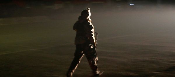 A member of the Afghan security forces arrives the site of an attack on the Intercontinental Hotel in Kabul, Afghanistan January 20, 2018. A member of the Afghan security forces arrives the site of an attack on the Intercontinental Hotel in Kabul, Afghanistan January 20, 2018. - Sputnik International