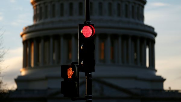 A traffic light shines red after President Donald Trump and the U.S. Congress failed to reach a deal on funding for federal agencies in Washington, U.S., January 20, 2018 A traffic light shines red after President Donald Trump and the U.S. Congress failed to reach a deal on funding for federal agencies in Washington, U.S., January 20, 2018 - Sputnik International