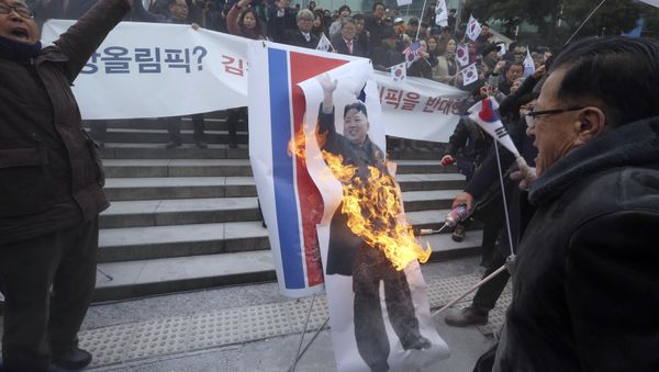 South Korean protesters burn a portrait of North Korean leader Kim Jong Un during a rally against a visit of North Korean Hyon Song Wol, head of a North Korean art troupe, in front of Seoul Railway Station in Seoul, South Korea, Monday, Jan. 22, 2018 South Korean protesters burn a portrait of North Korean leader Kim Jong Un during a rally against a visit of North Korean Hyon Song Wol, head of a North Korean art troupe, in front of Seoul Railway Station in Seoul, South Korea, Monday, Jan. 22, 2018 - Sputnik International