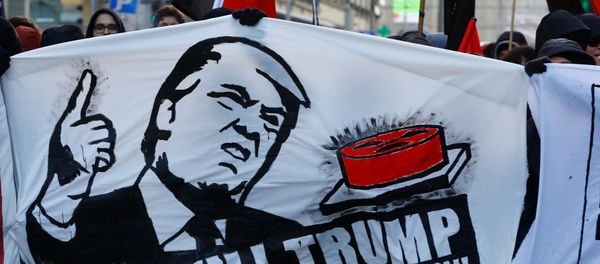 Protesters with banners march during an anti-WEF and anti-US President Donald Trump demonstration, ahead of Trump's visit to the World Economic Forum (WEF), in Bern, Switzerland, January 13, 2018. - Sputnik International