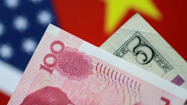 U.S. Dollar and China Yuan notes are seen in this picture illustration June 2, 2017 - Sputnik International