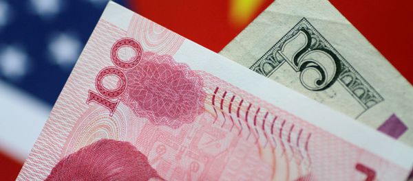 U.S. Dollar and China Yuan notes are seen in this picture illustration June 2, 2017 - Sputnik International