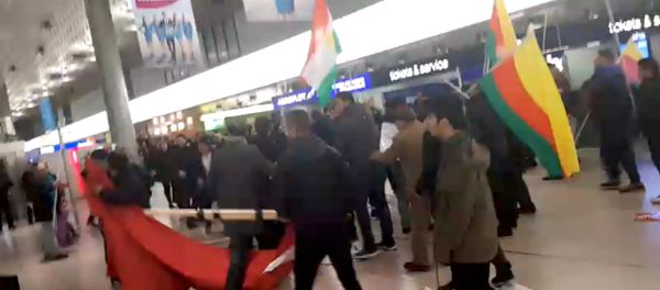 A fight breaks out during a demonstration against Turkish military operation in Syria, in the Hannover Airport, Germany, in this still image taken from a social media video January 22, 2018 - Sputnik International
