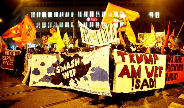Protesters carry banners during a demonstration against U.S. President Trump in Zurich Protesters carry banners during a demonstration against U.S. President Trump in Zurich - Sputnik International
