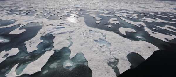Sea ice melts on the Franklin Strait along the Northwest Passage in the Canadian Arctic Archipelago, Saturday, July 22, 2017. Because of climate change, more sea ice is being lost each summer than is being replenished in winters. Less sea ice coverage also means that less sunlight will be reflected off the surface of the ocean in a process known as the albedo effect. The oceans will absorb more heat, further fueling global warming. - Sputnik International
