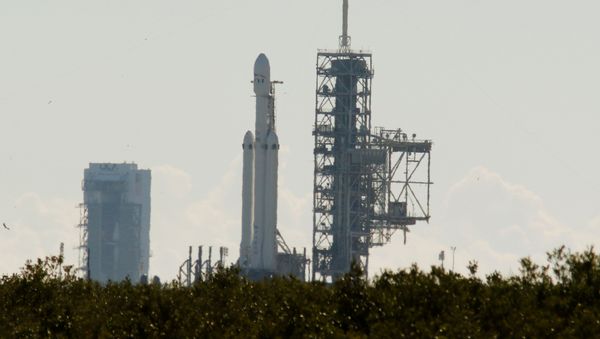 SpaceX's first Falcon Heavy rocket sits on launch pad 39A at Kennedy Space Center, waiting for the first engine test firing it's 27 engines together, in Cape Canaveral, Florida - Sputnik International
