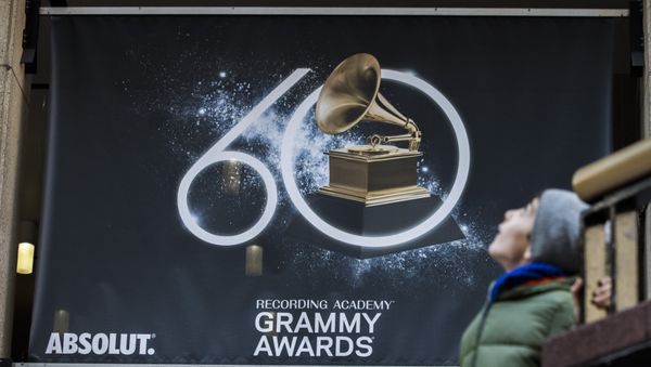 A young boy walks past advertisements promoting the 60th Annual Grammy Awards at the Madison Square Garden in New York on January 26, 2018 A young boy walks past advertisements promoting the 60th Annual Grammy Awards at the Madison Square Garden in New York on January 26, 2018 - Sputnik International
