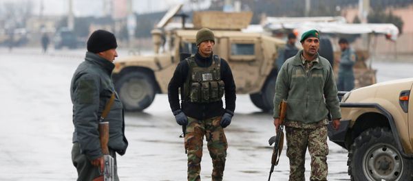 Afghan security forces keep watch near the site of an attack at the Marshal Fahim military academy in Kabul, Afghanistan January 29, 2018 - Sputnik International
