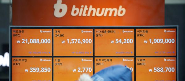 A man walks past an electric board showing exchange rates of various cryptocurrencies at Bithumb cryptocurrencies exchange in Seoul, South Korea, January 11, 2018 A man walks past an electric board showing exchange rates of various cryptocurrencies at Bithumb cryptocurrencies exchange in Seoul, South Korea, January 11, 2018 - Sputnik International
