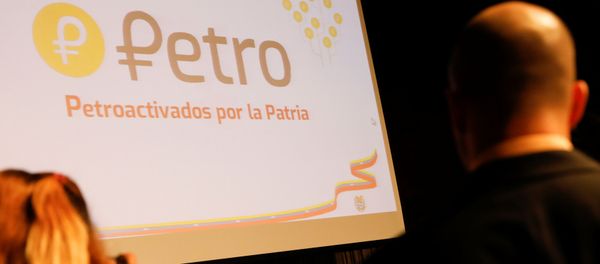 The new Venezuelan cryptocurrency the Petro logo is seen as Minister for University Education, Science and Technology Hugbel Roa talks to the media during a news conference in Caracas, Venezuela, January 31, 2018 The new Venezuelan cryptocurrency the Petro logo is seen as Minister for University Education, Science and Technology Hugbel Roa talks to the media during a news conference in Caracas, Venezuela, January 31, 2018 - Sputnik International