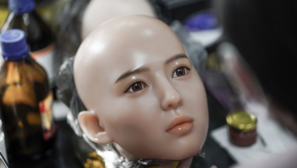 This photo taken on February 1, 2018 shows a worker painting the face of a silicone doll at a factory of EXDOLL, a firm based in the northeastern Chinese port city of Dalian - Sputnik International
