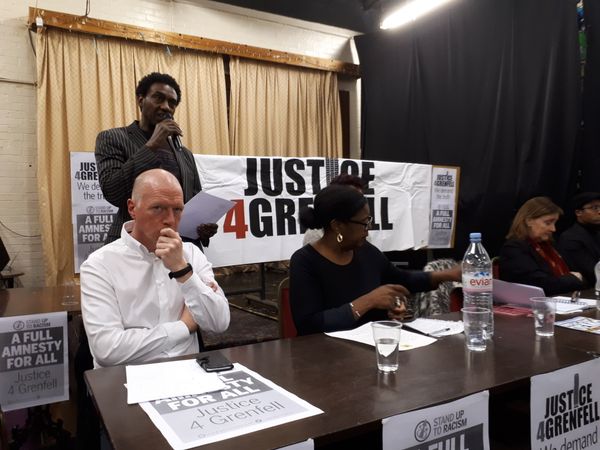 FBU leader Matt Wrack (seated, far left) listens as a resident reads out the names of the Grenfell Tower victims - Sputnik International