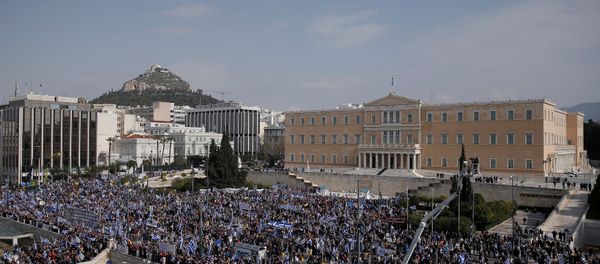 People are seen gathered outside the parliament building during a rally against the use of the term Macedonia in any settlement to a dispute between Athens and Skopje over the former Yugoslav republic's name, in Athens, Greece, February 4, 2018 - Sputnik International