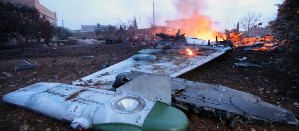 A picture taken on February 3, 2018, shows smoke billowing from the site of a downed Sukhoi-25 fighter jet in Syria's northwest province of Idlib A picture taken on February 3, 2018, shows smoke billowing from the site of a downed Sukhoi-25 fighter jet in Syria's northwest province of Idlib - Sputnik International