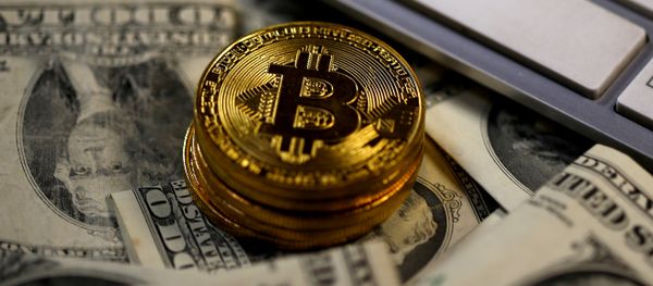 Bitcoin (virtual currency) coins placed on Dollar banknotes, next to computer keyboard, are seen in this illustration picture, November 6, 2017 Bitcoin (virtual currency) coins placed on Dollar banknotes, next to computer keyboard, are seen in this illustration picture, November 6, 2017 - Sputnik International