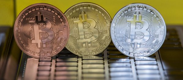 A picture taken on February 6, 2018 shows a visual representation of the digital crypto-currency Bitcoin, at the Bitcoin Change shop in the Israeli city of Tel Aviv A picture taken on February 6, 2018 shows a visual representation of the digital crypto-currency Bitcoin, at the Bitcoin Change shop in the Israeli city of Tel Aviv - Sputnik International