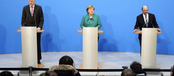 German Chancellor Angela Merkel, Chairwoman of the Christian Democratic Union, CDU, is flanked by Martin Schulz, right, chairman of the Social Democratic Party, SPD, and Bavarian Governor Horst Seehofer, chairman of the Christian Social Union, CSU German Chancellor Angela Merkel, Chairwoman of the Christian Democratic Union, CDU, is flanked by Martin Schulz, right, chairman of the Social Democratic Party, SPD, and Bavarian Governor Horst Seehofer, chairman of the Christian Social Union, CSU - Sputnik International