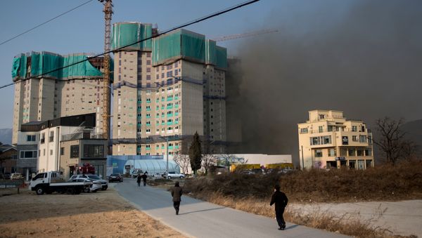 Smoke from a fire is seen near the Kwandong Hockey Centre prior to the Pyeongchang 2018 Winter Olympic Games on February 8, 2018 in Gangneung, South Korea - Sputnik International